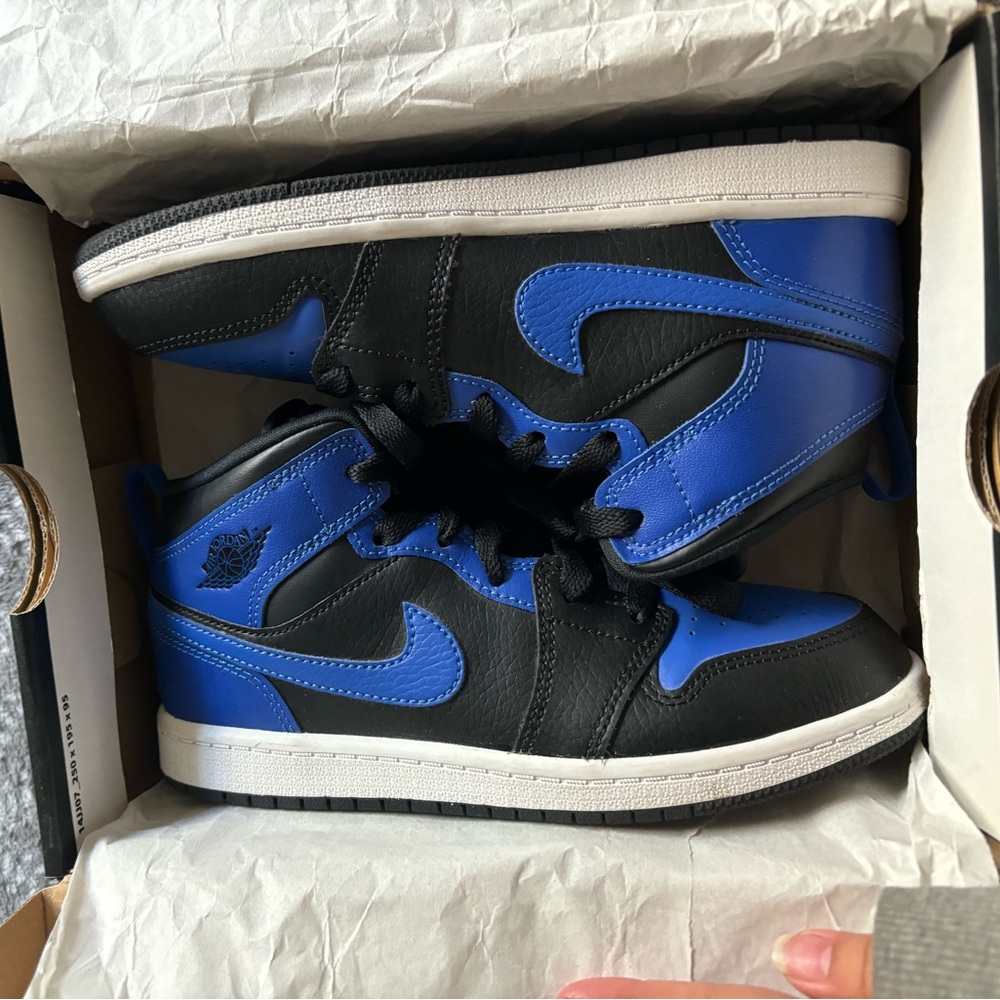Black and royal blue mid Nike Jordan 1s